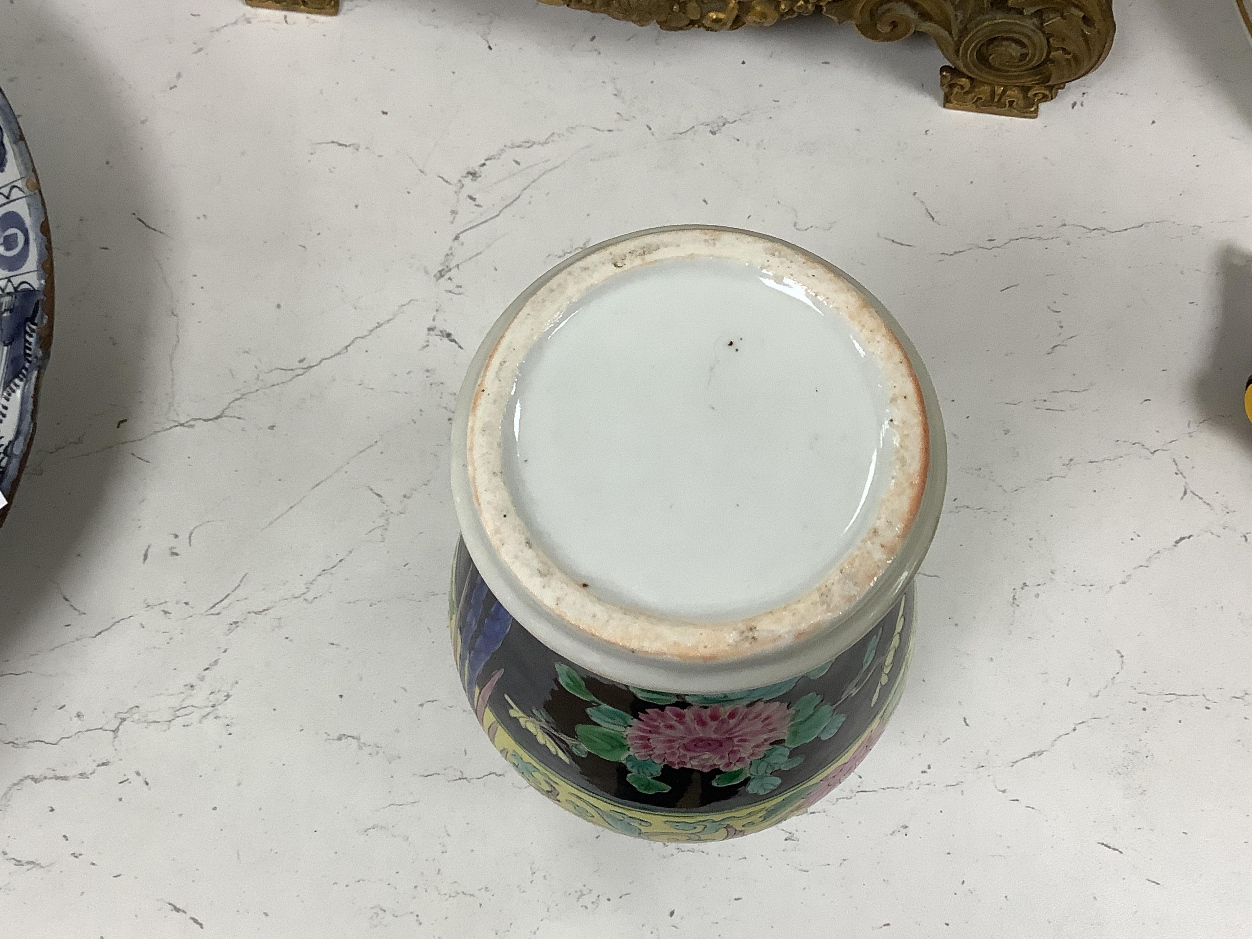 Chinese porcelain- a tall 19th century famille rose vase and cover, a famille rose jar, early 19th century probably made the Indian market, a famille noire jar and a Japanese vase, tallest 28cm high